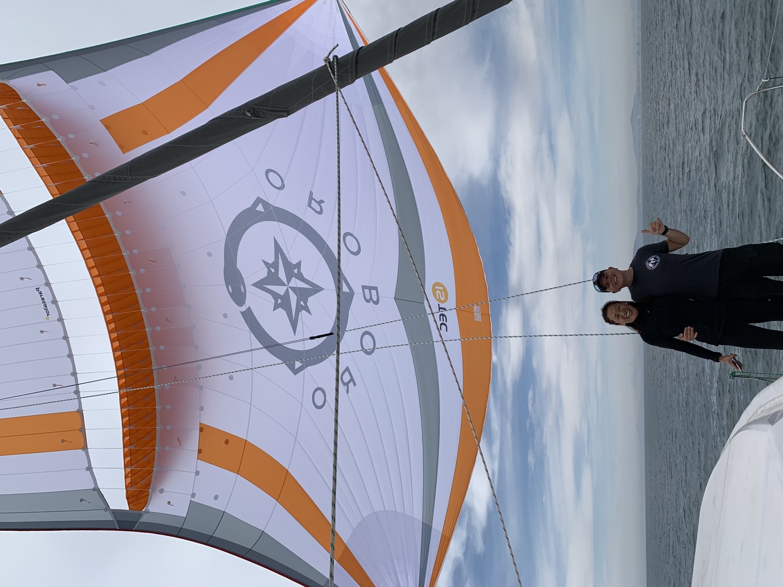 Francesco and Yuka under the Parasailor on its first sail — the moment we had been dreaming of