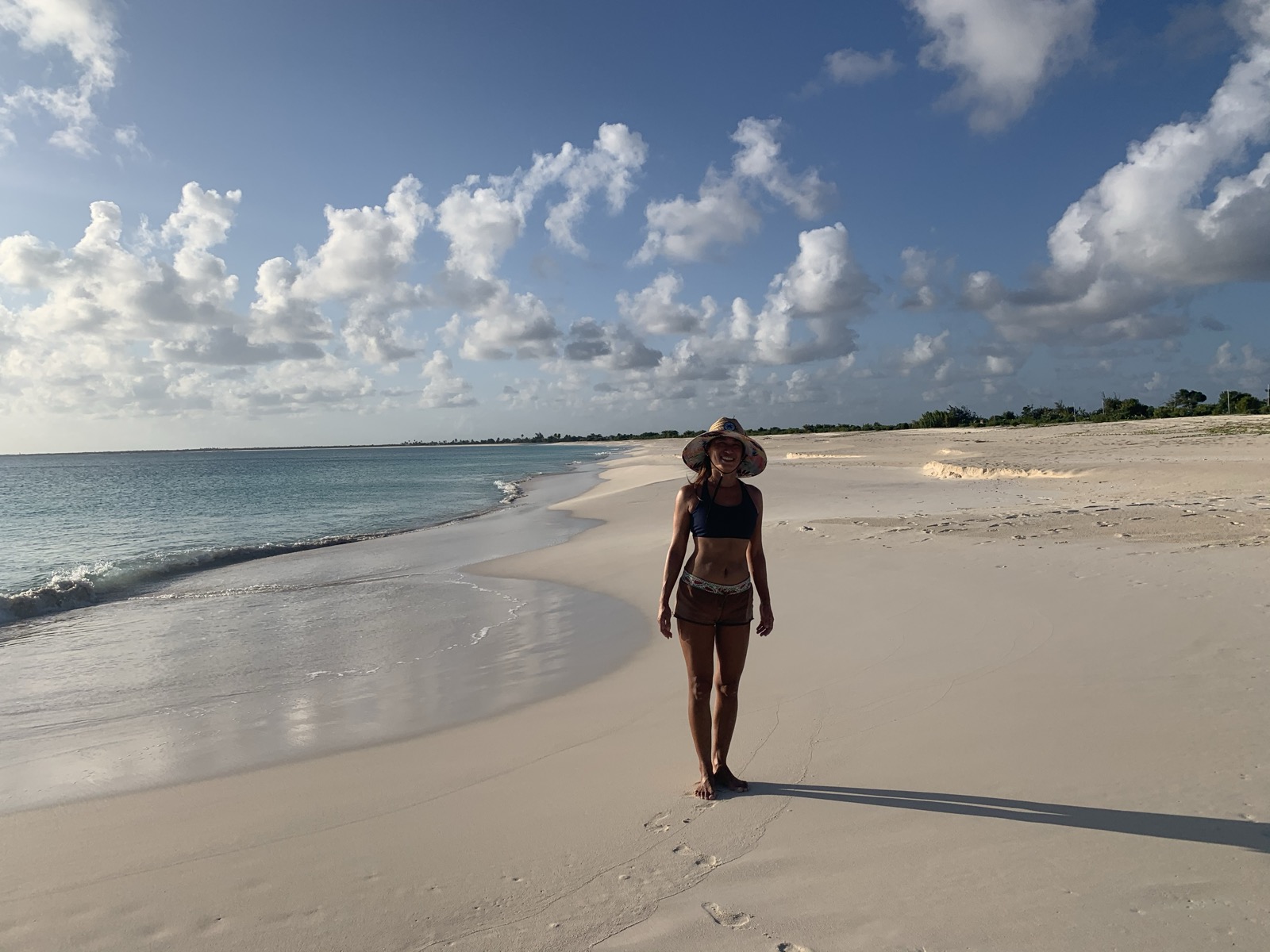 Yuka walking an empty Barbuda beach — the island was ours