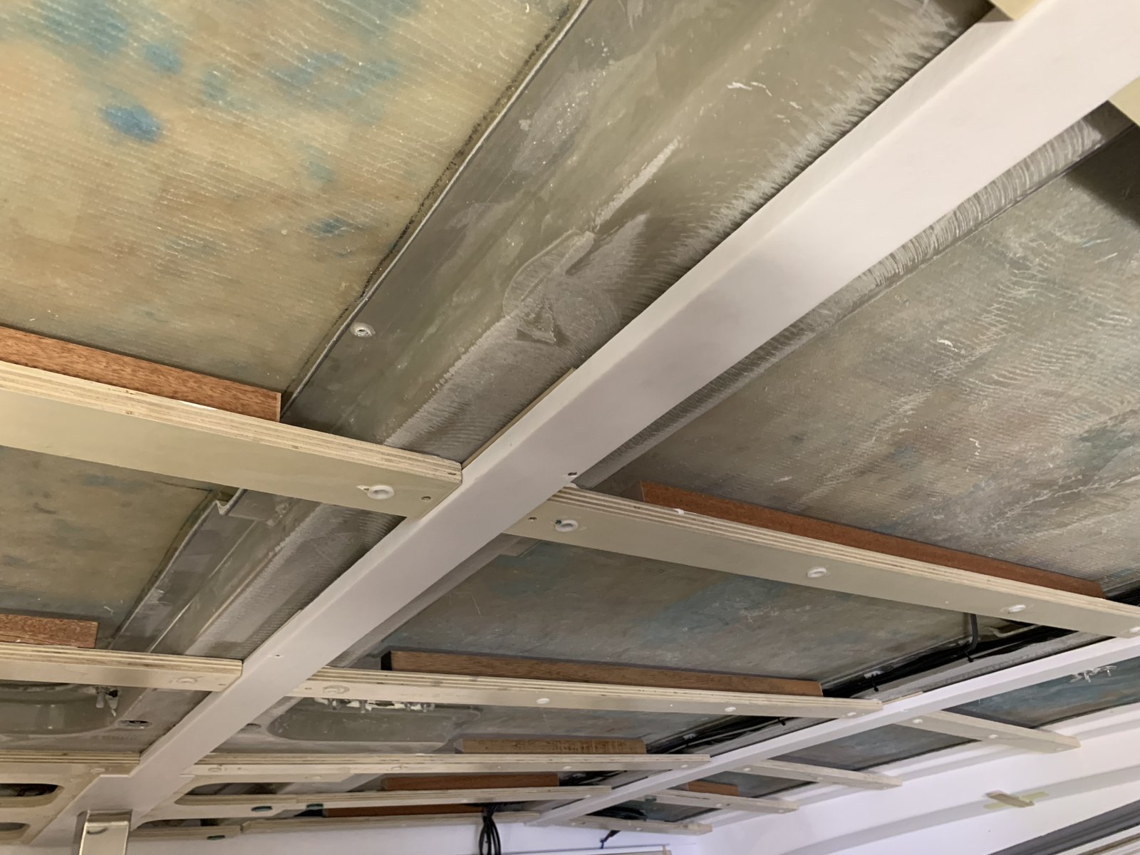 The vacuum infusion process draws resin through the laminate
