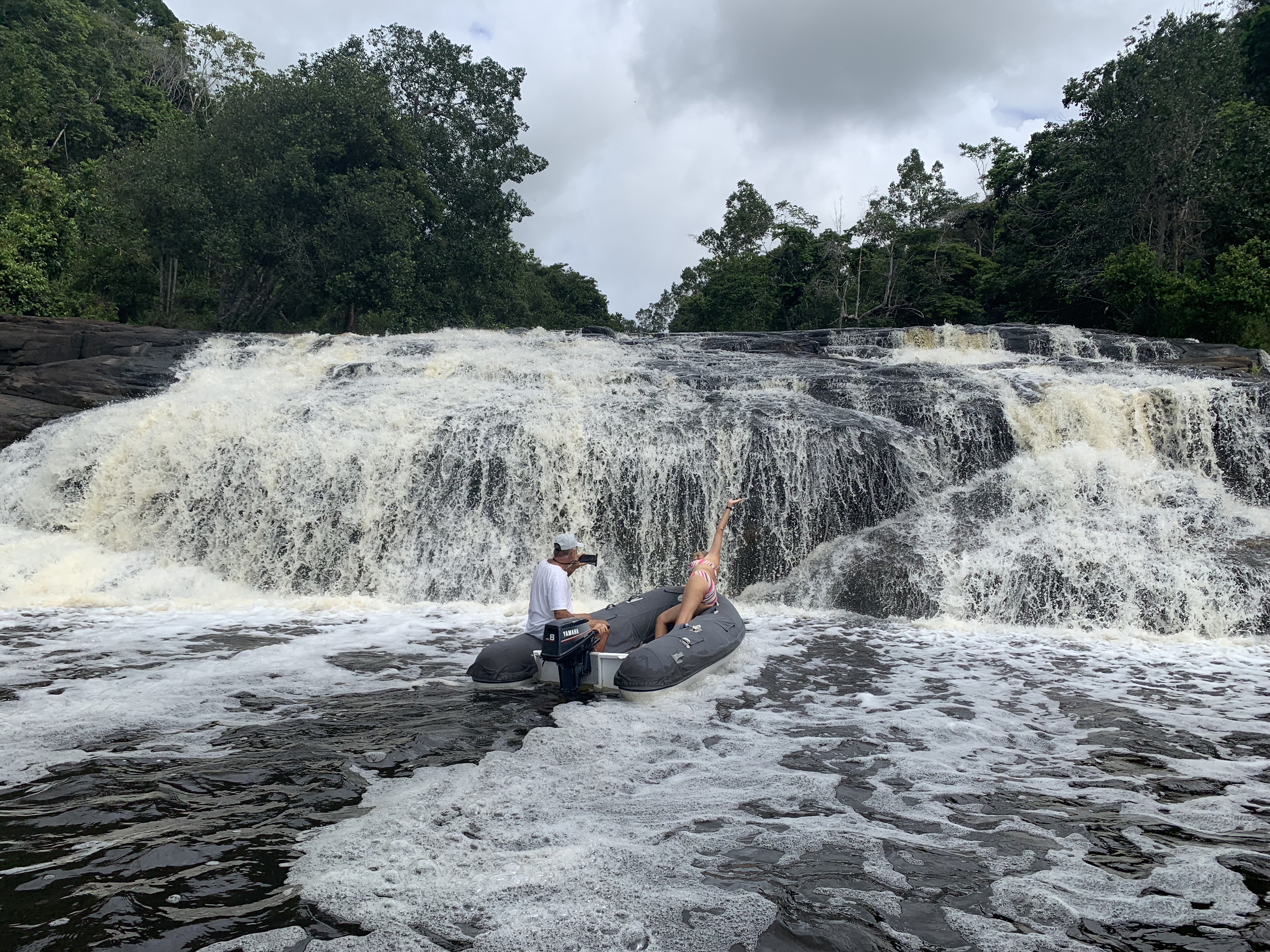 Yuka somersaulting off the bow of the dinghy into the waterfall pool