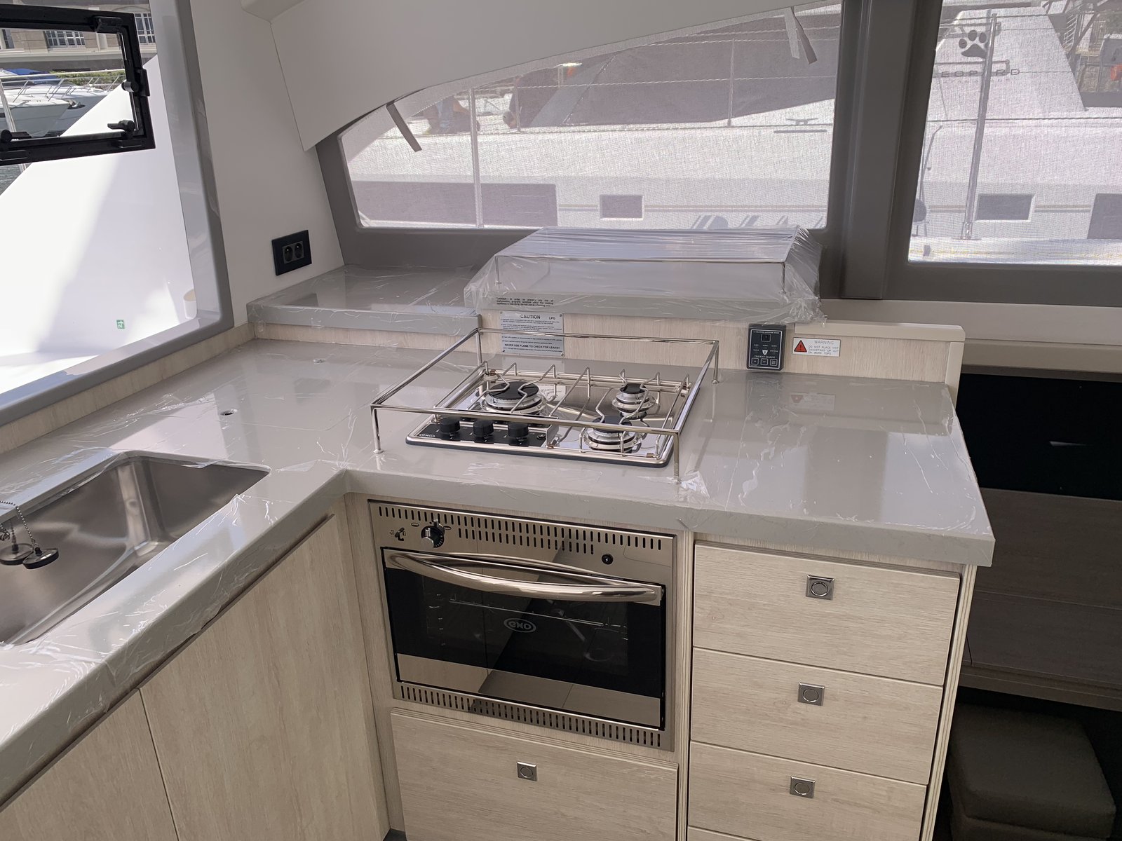 The galley stove and oven — still wrapped from the factory