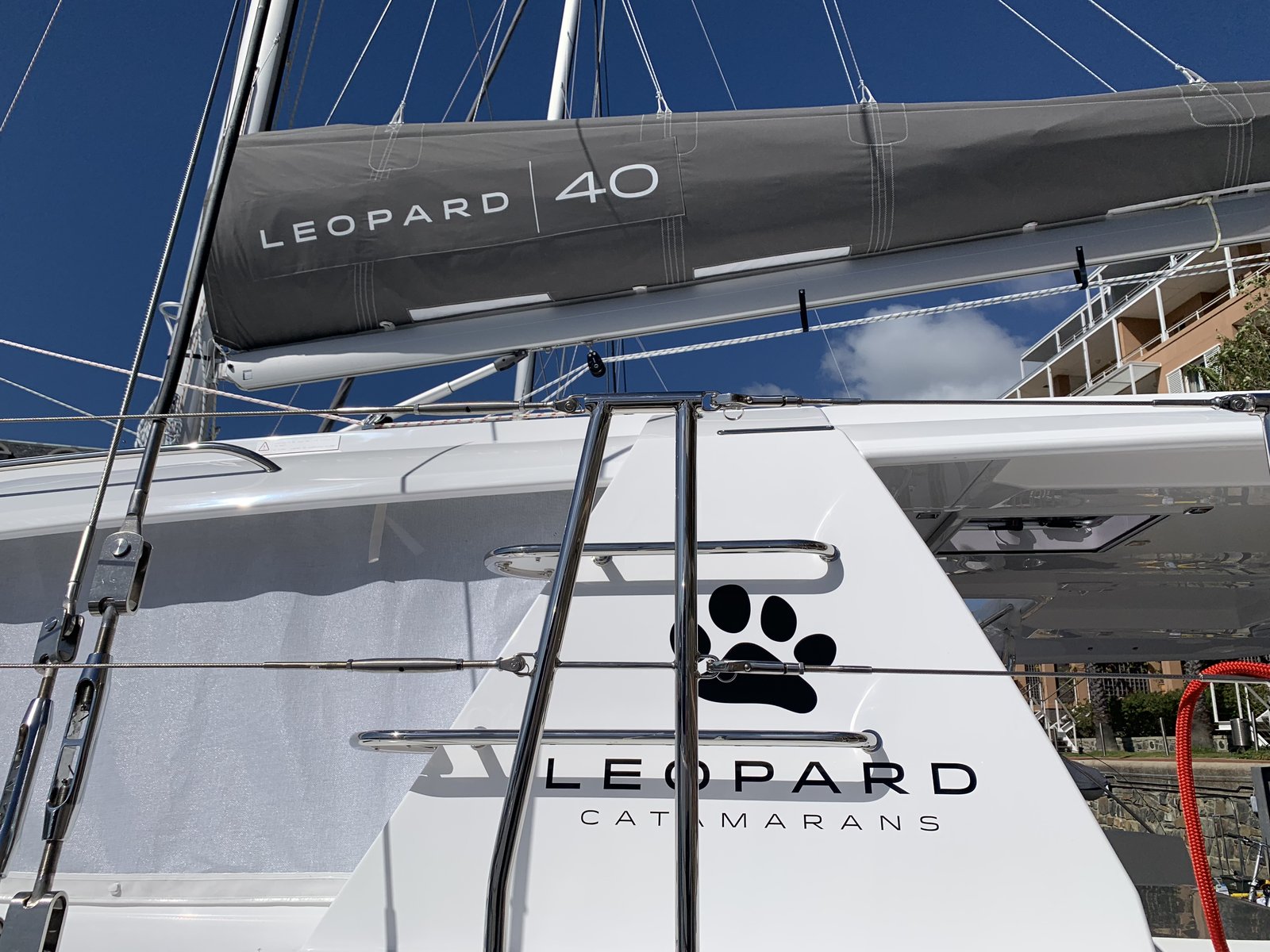 The Leopard 40 logo on the mainsail and Leopard Catamarans branding on the hull