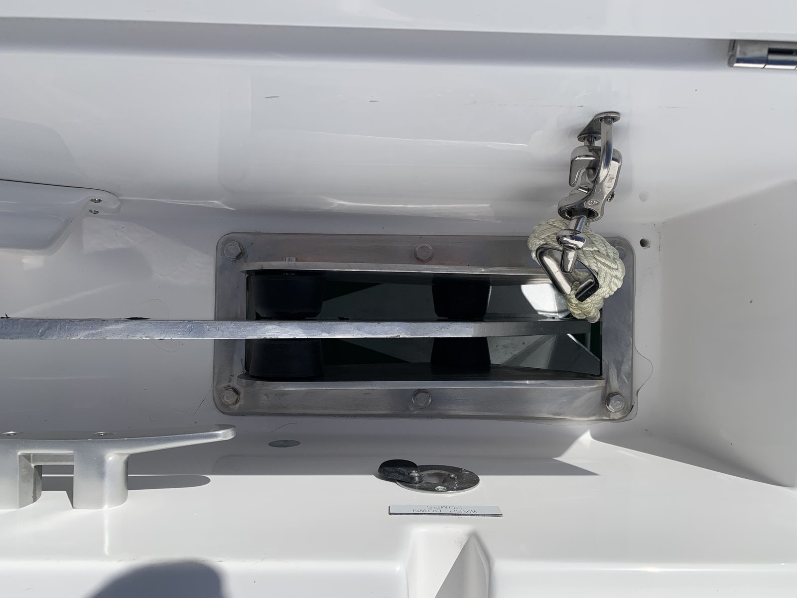 The anchor locker and chain hawse pipe at the bow