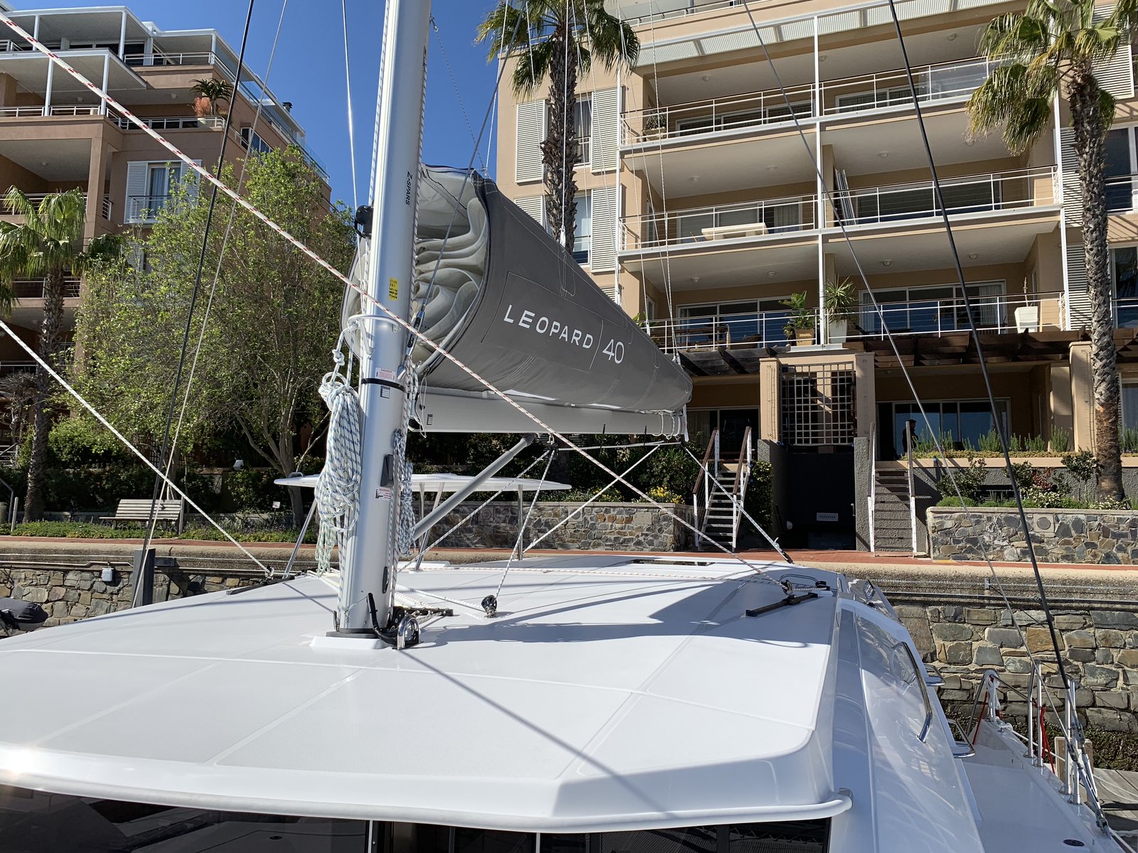 The furled mainsail on the boom, with the Leopard 40 logo