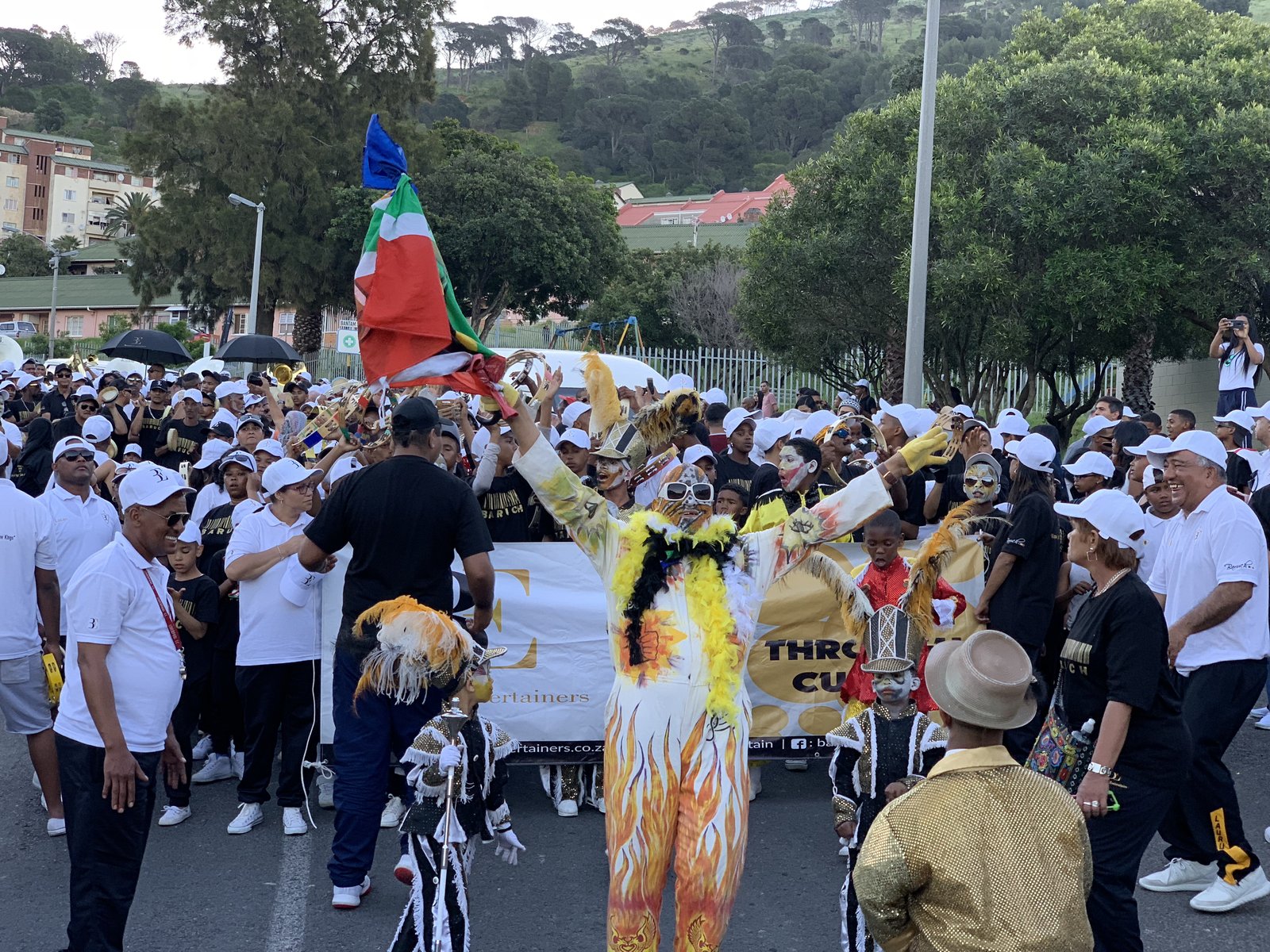 The Bo-Kaap street parade — dancers, musicians, and feathered costumes
