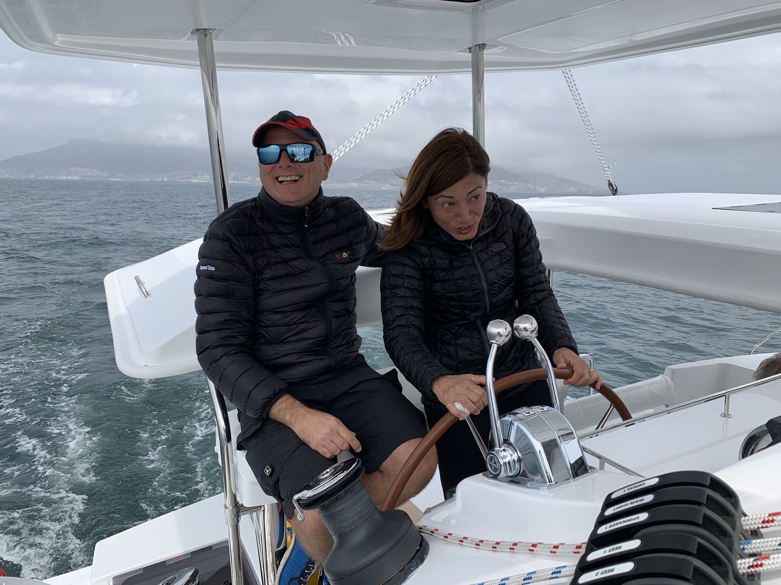 Francesco and Yuka at the helm during Oroboro's first sea trial in Table Bay