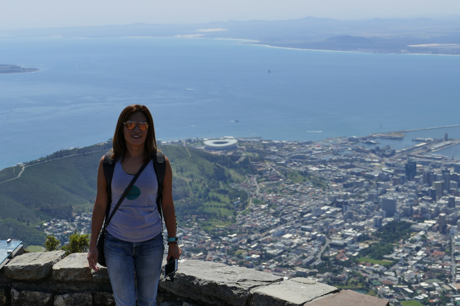 Yuka on top of Table Mountain — Cape Town and Table Bay laid out below