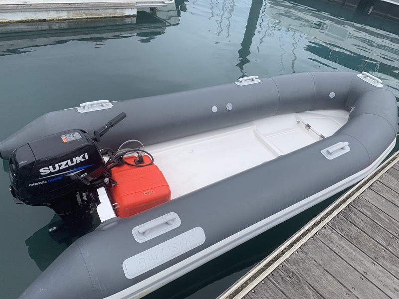 The new Ballistic dinghy with its Suzuki outboard at the dock for the first time