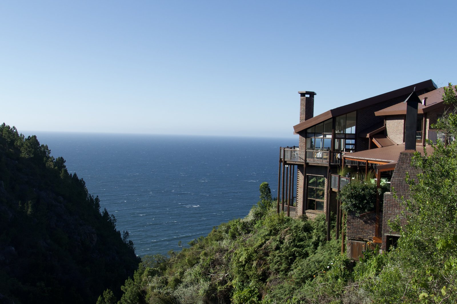 The lodge perched on a clifftop above the ocean