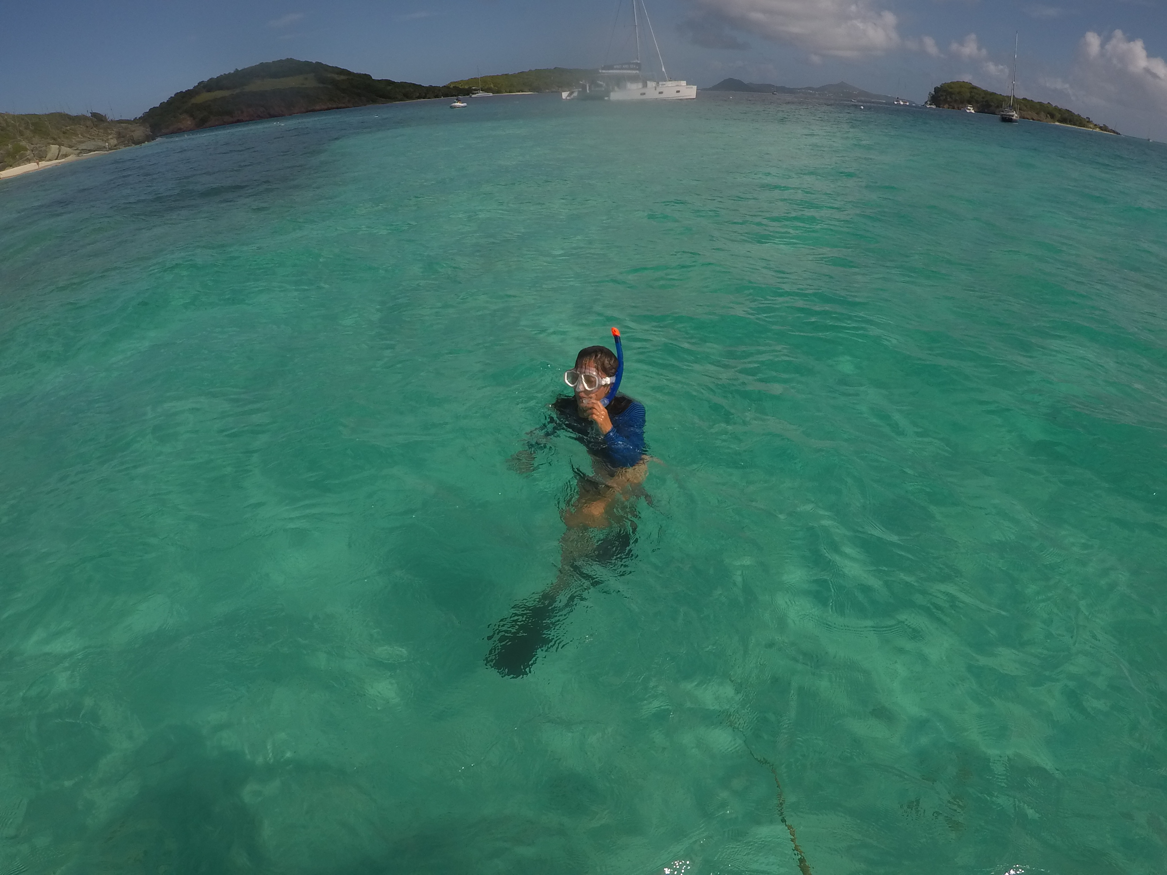 Yuka snorkeling — Oroboro and the island are just behind her