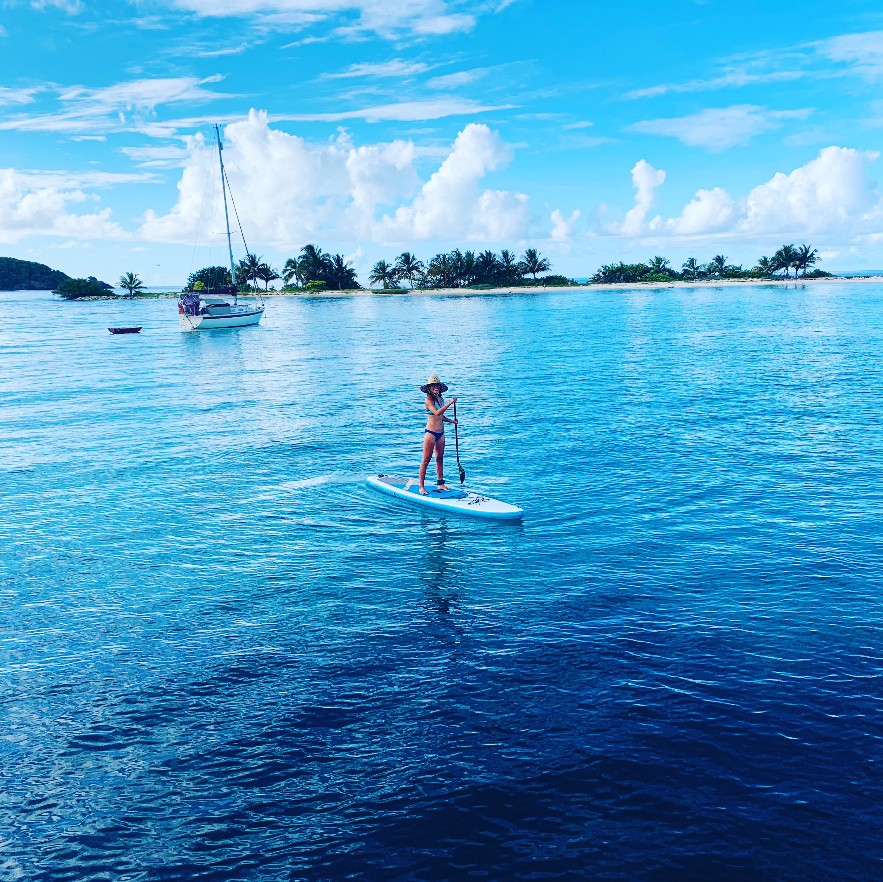 Yuka SUP paddling near the palm-fringed islets north of Carriacou