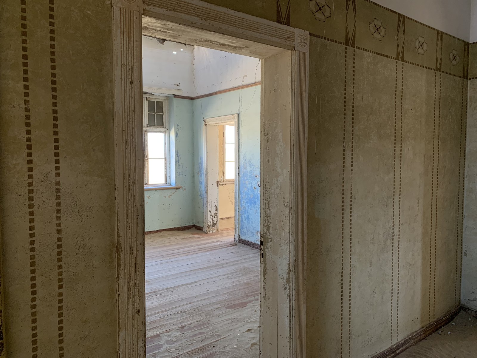Sand has reclaimed the interiors over decades of abandonment