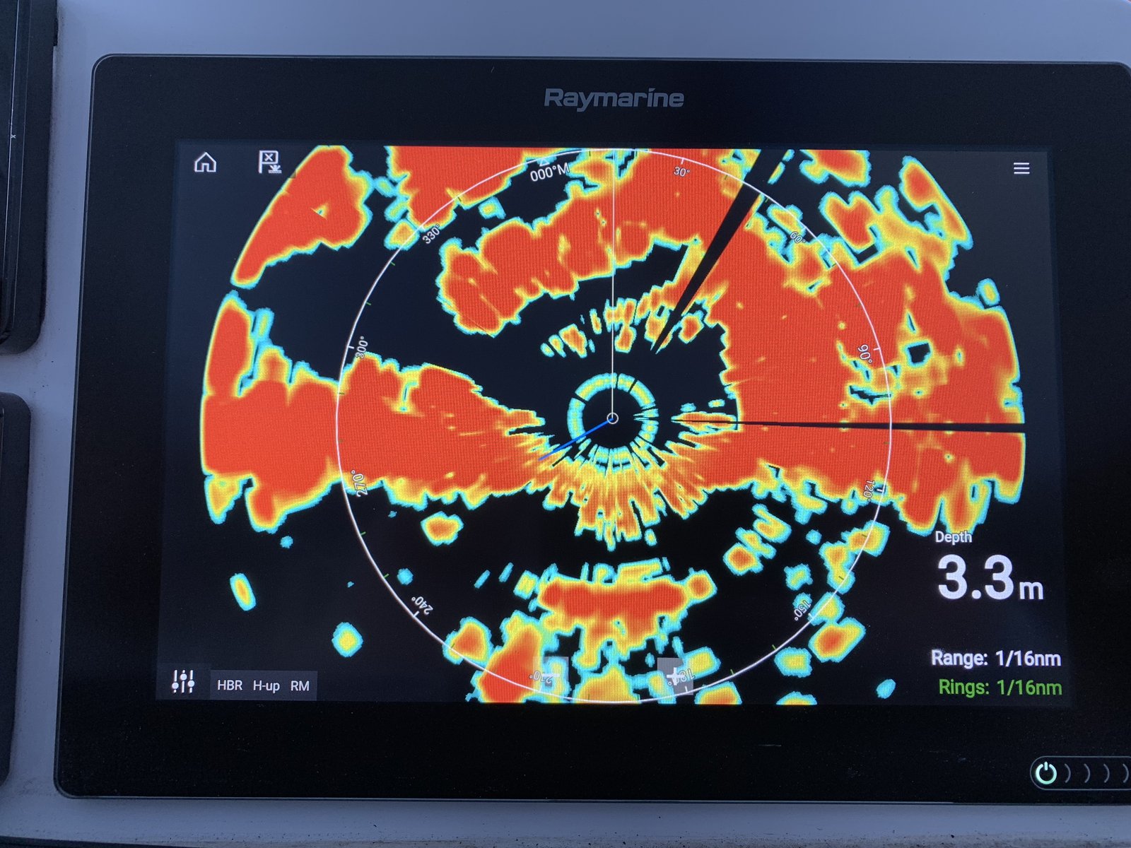 The Raymarine radar display — vessels around us and the 3.3m marina depth at a glance