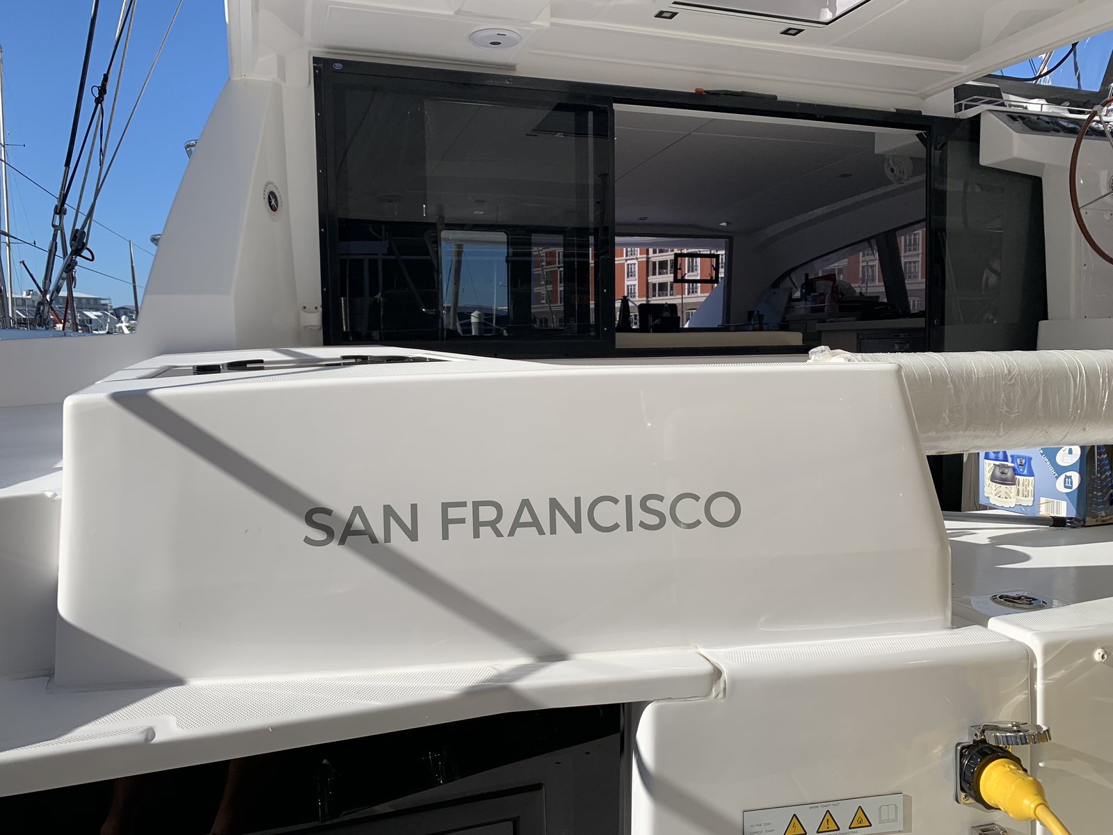 San Francisco — our home port, lettered on the hull