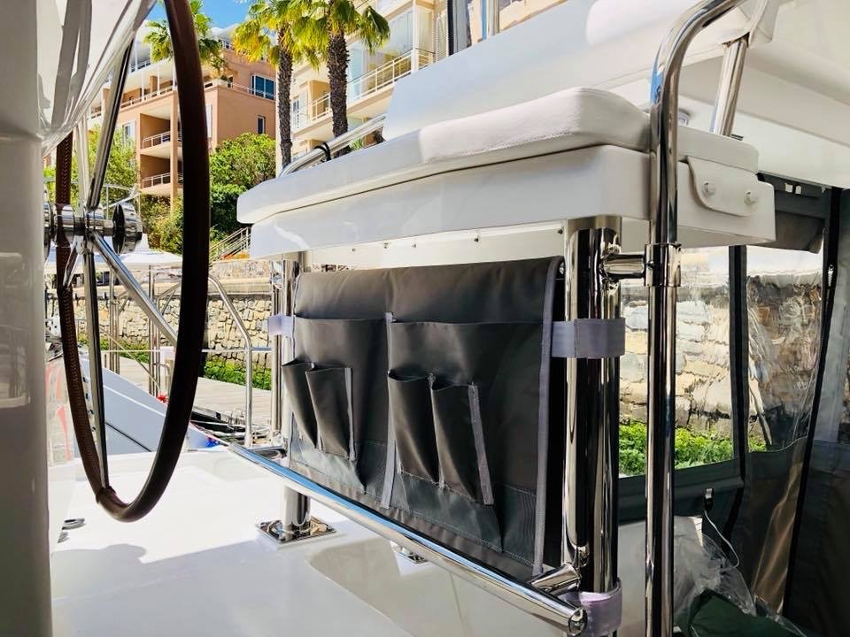 A custom line organizer mounted at the helm station