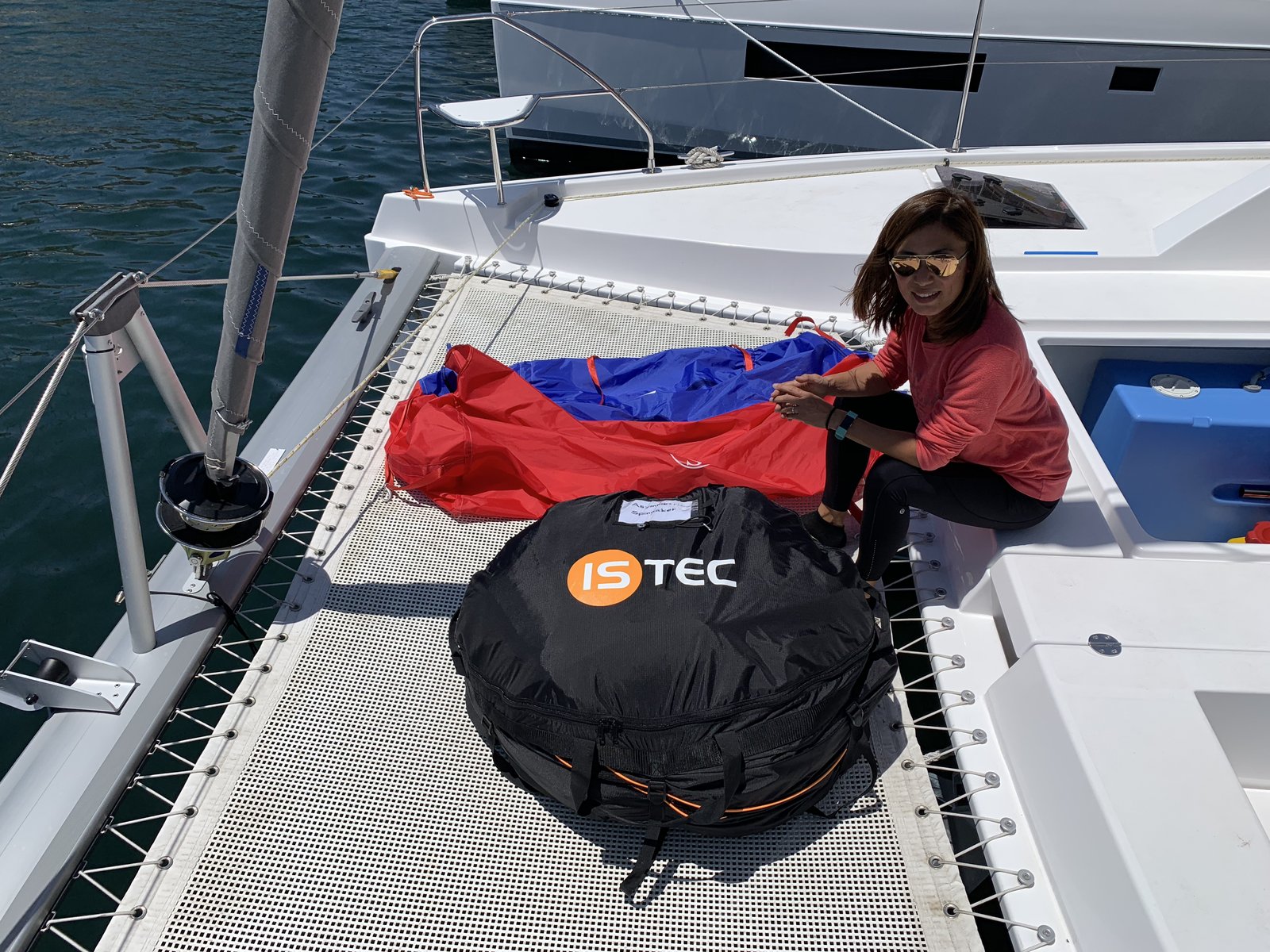 Yuka unpacking the ISTEC parasailor bag on the foredeck