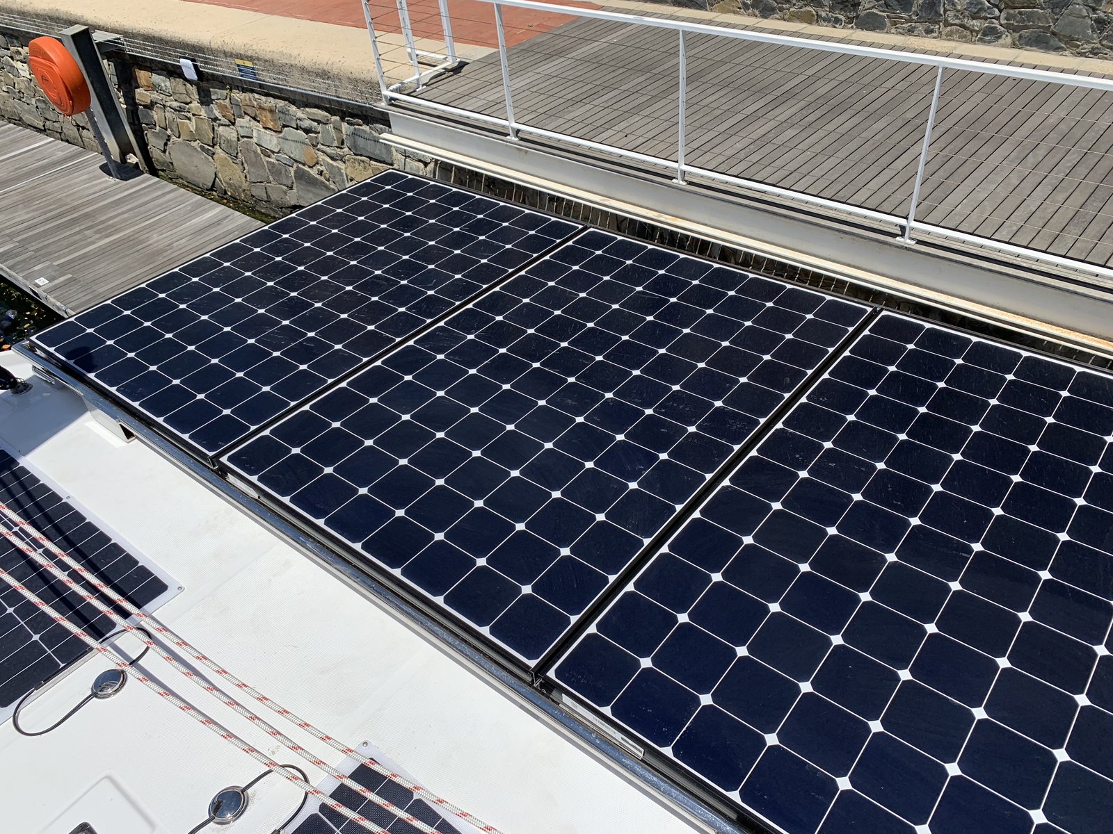 Three rigid SunPower panels mounted on the custom stainless steel arch on the bimini