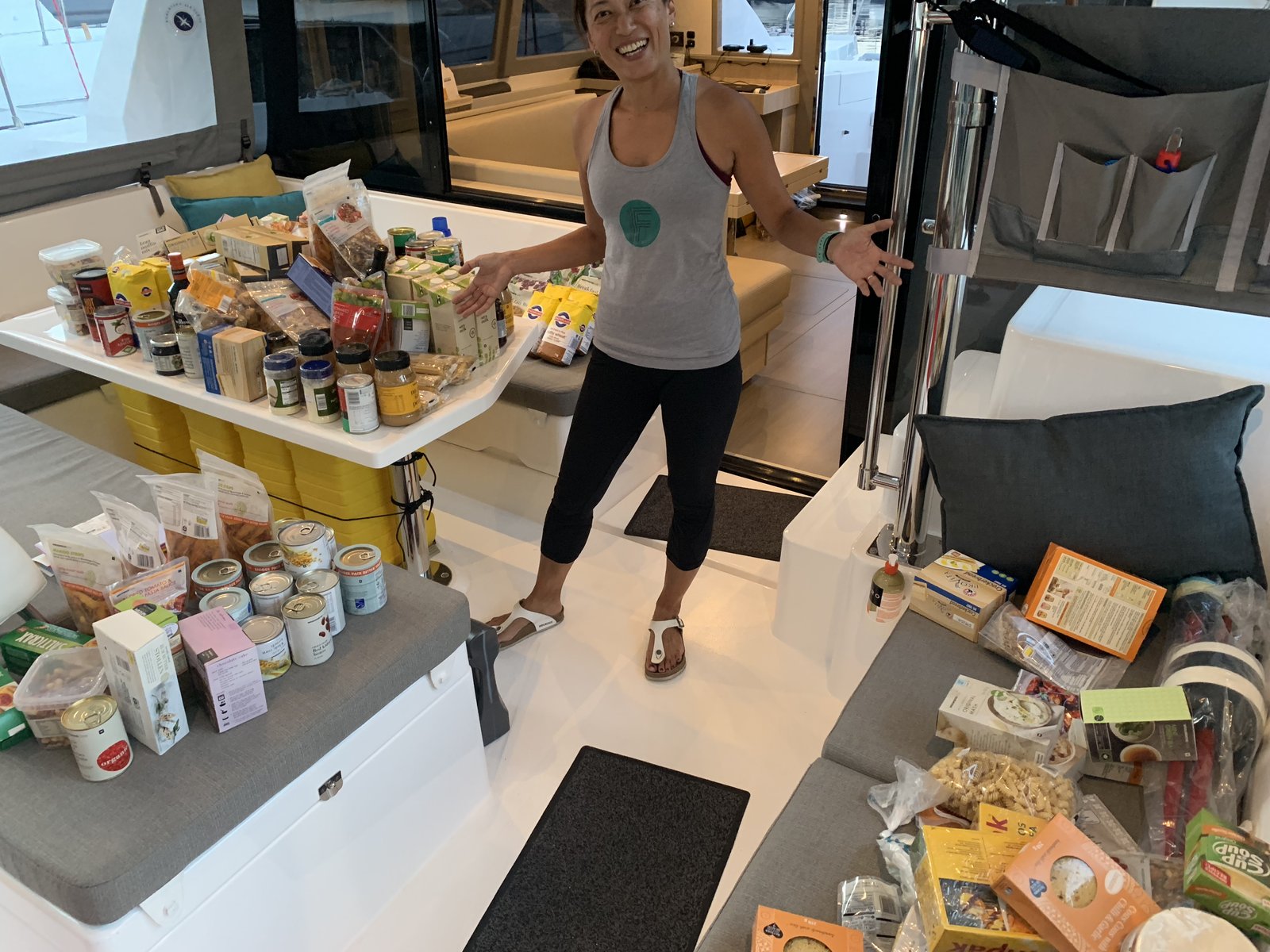 Yuka surrounded by the full provision inventory spread across the saloon