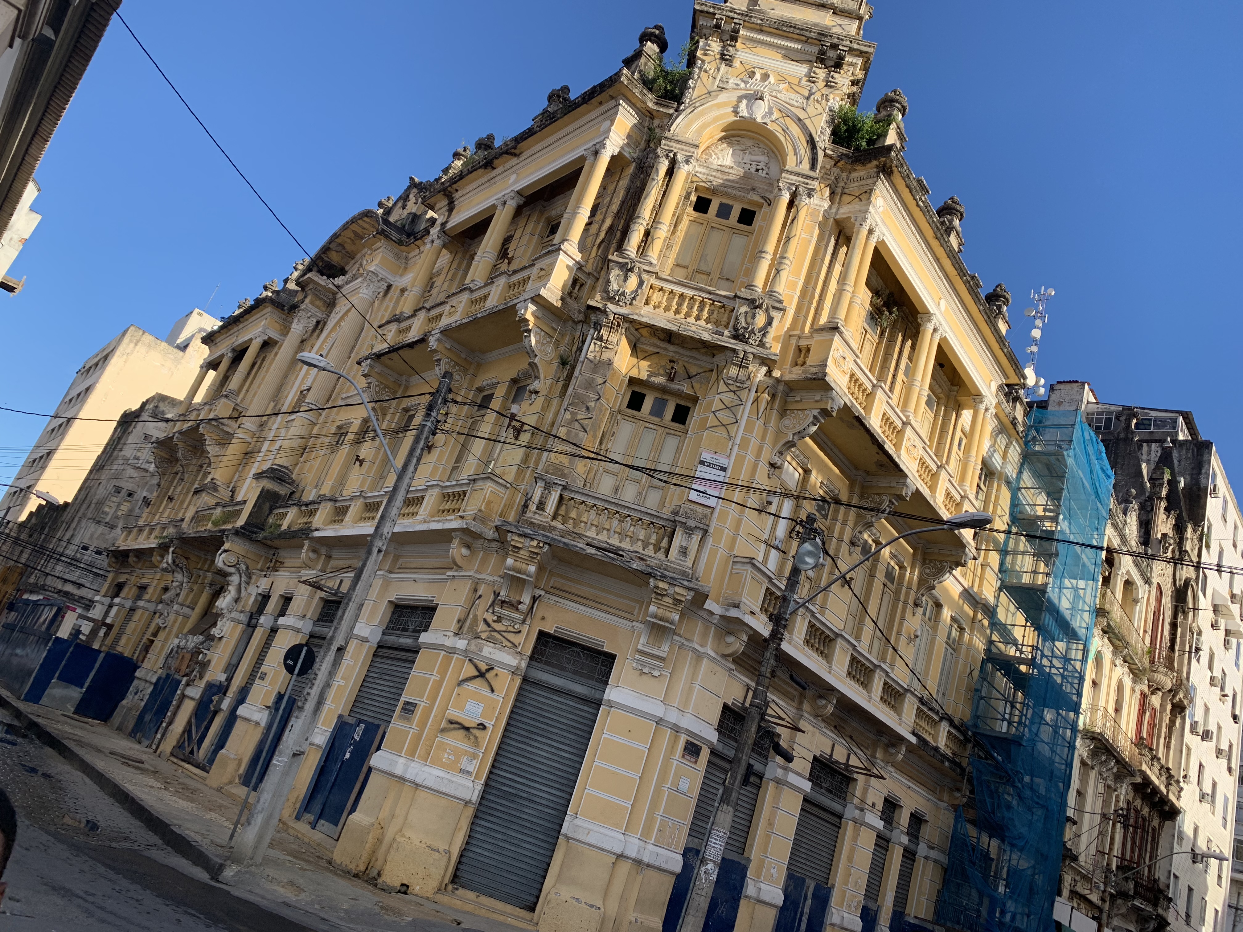 A yellow colonial building under restoration in the historic centre
