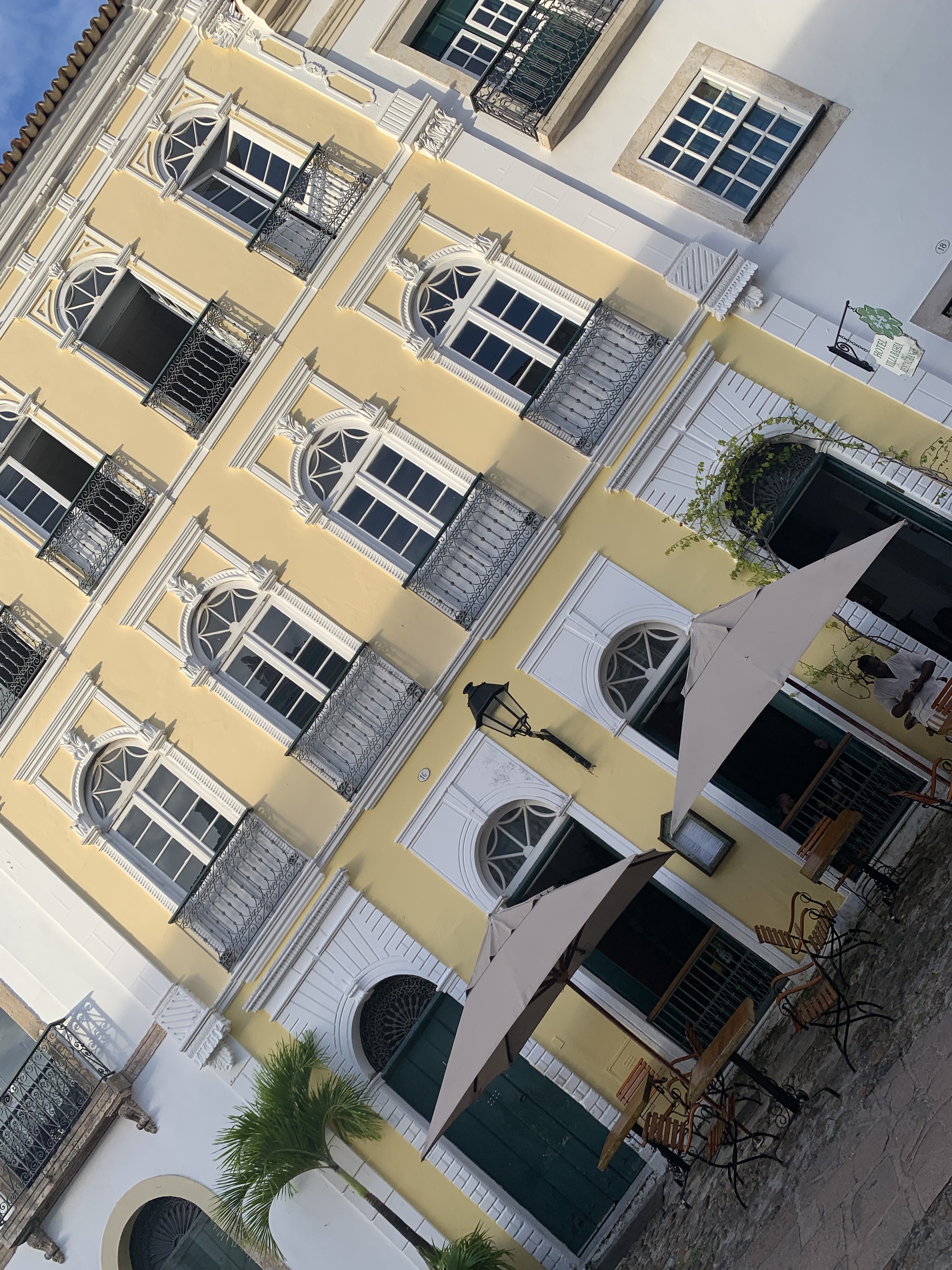 A yellow colonial café building in Pelourinho