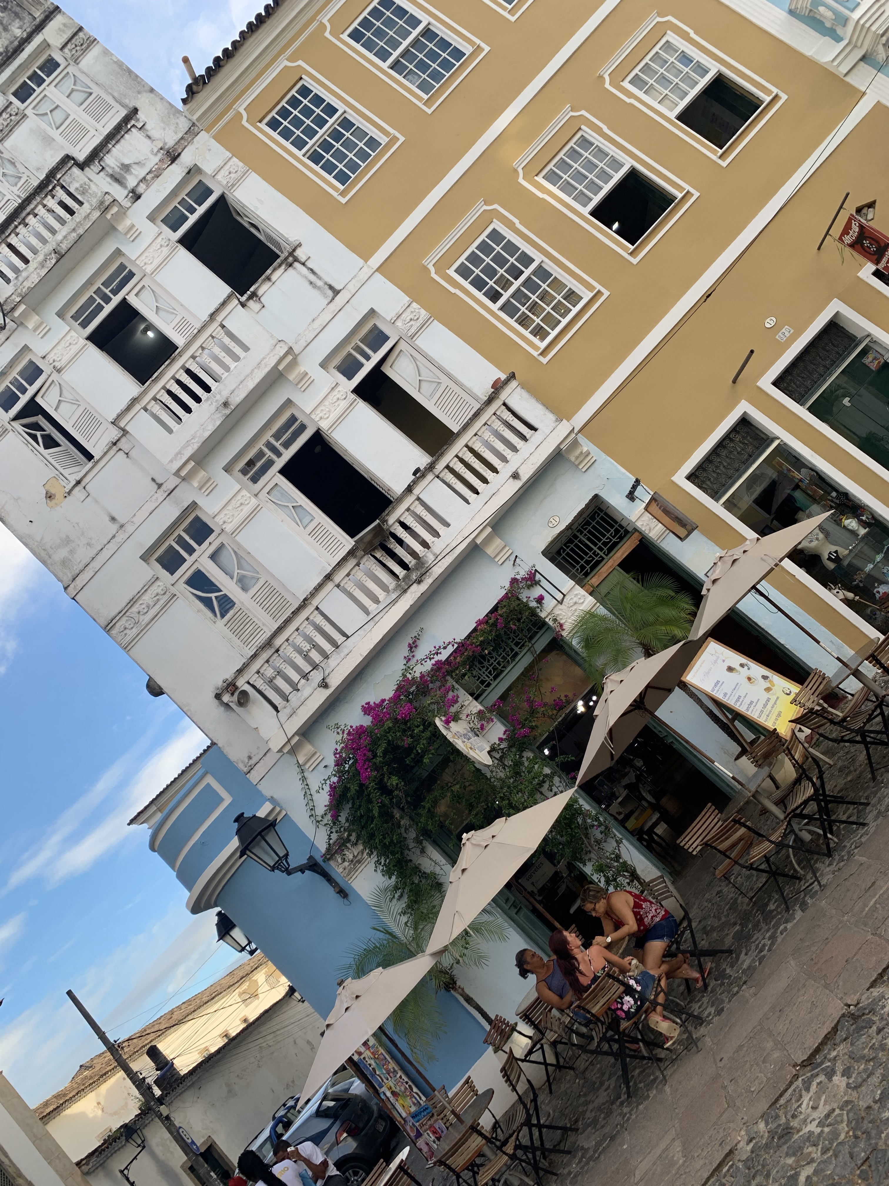 A yellow colonial café and restaurant at a Pelourinho corner