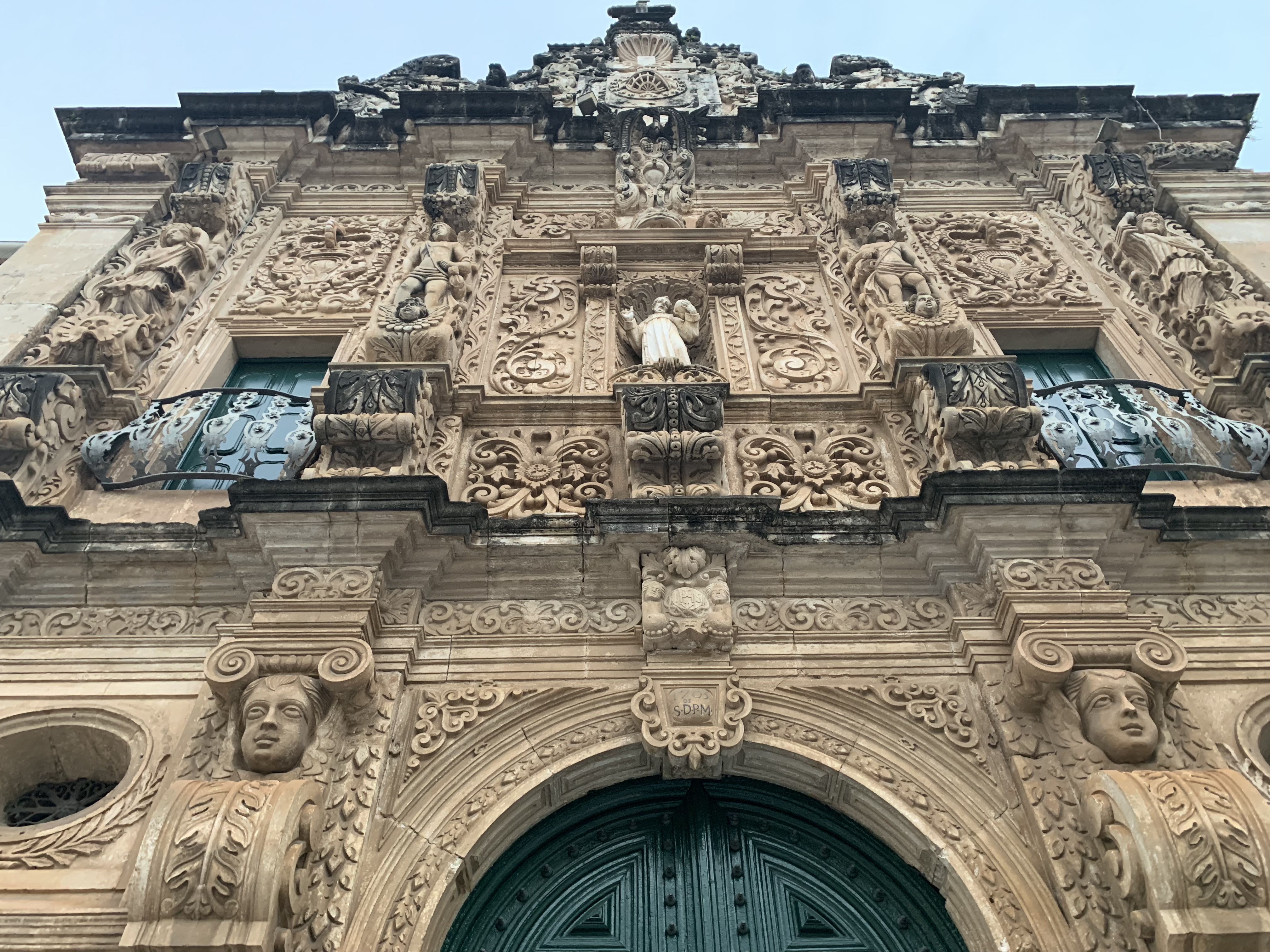 The São Francisco upper baroque facade with royal crest and statues