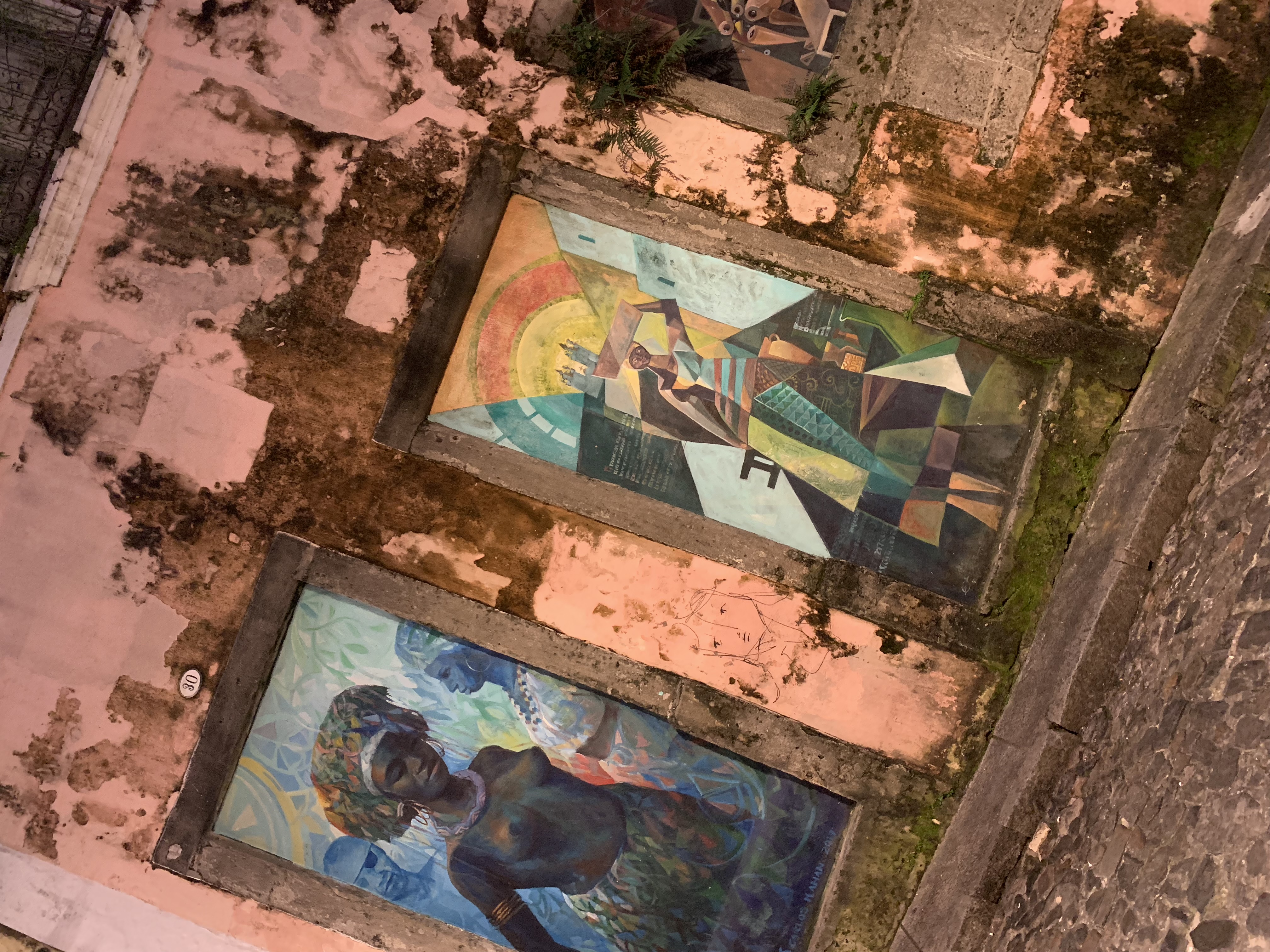 Two floor murals — a cubist and an Afro-Brazilian figure