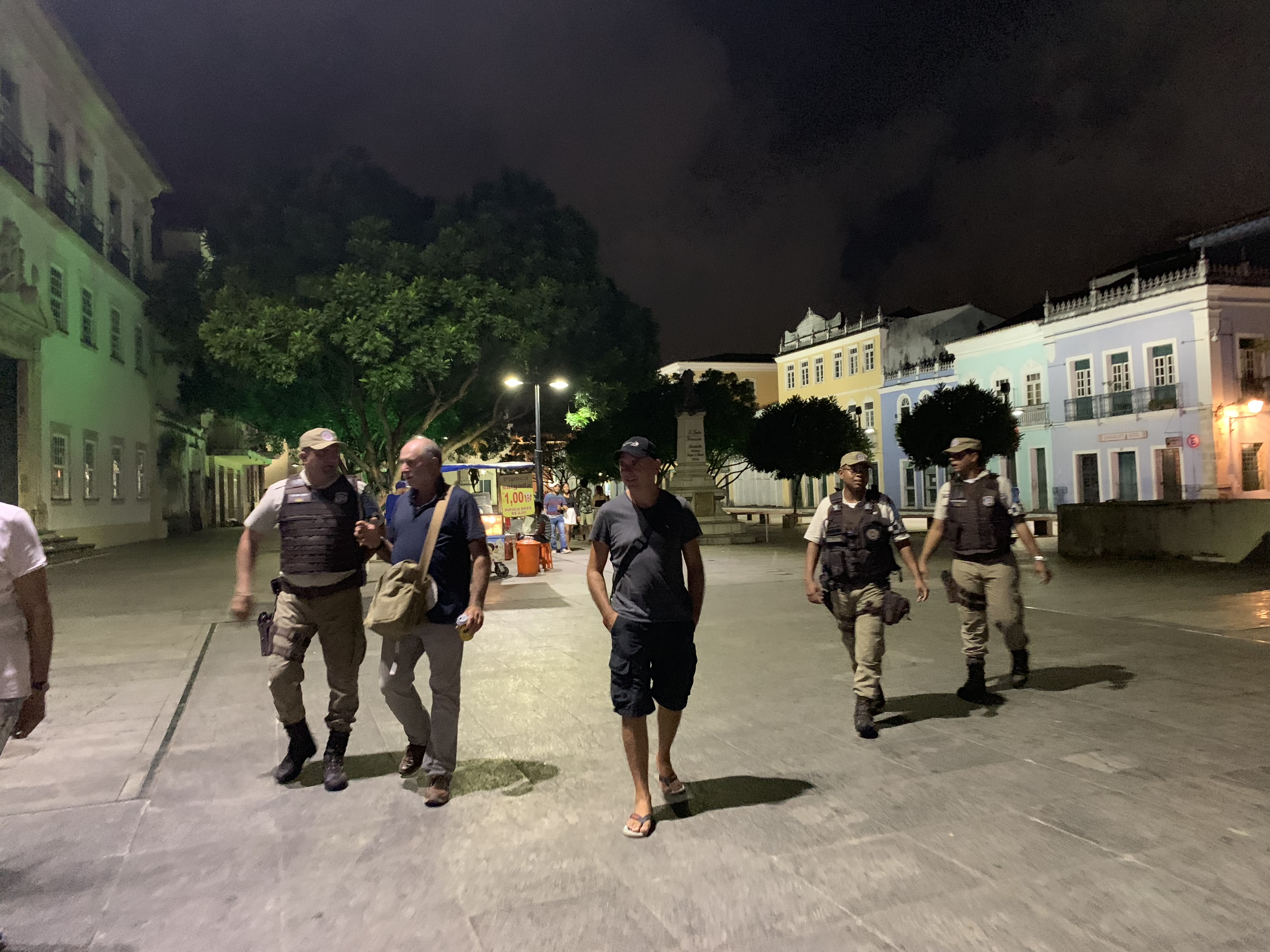 Francesco walking through Pelourinho with a military police escort