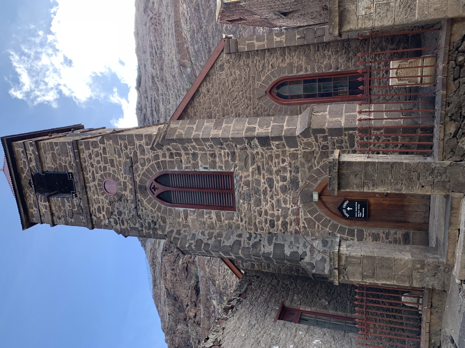 St James' Church tower in Jamestown — stone construction with Gothic arched windows, the oldest Anglican church in the Southern Hemisphere