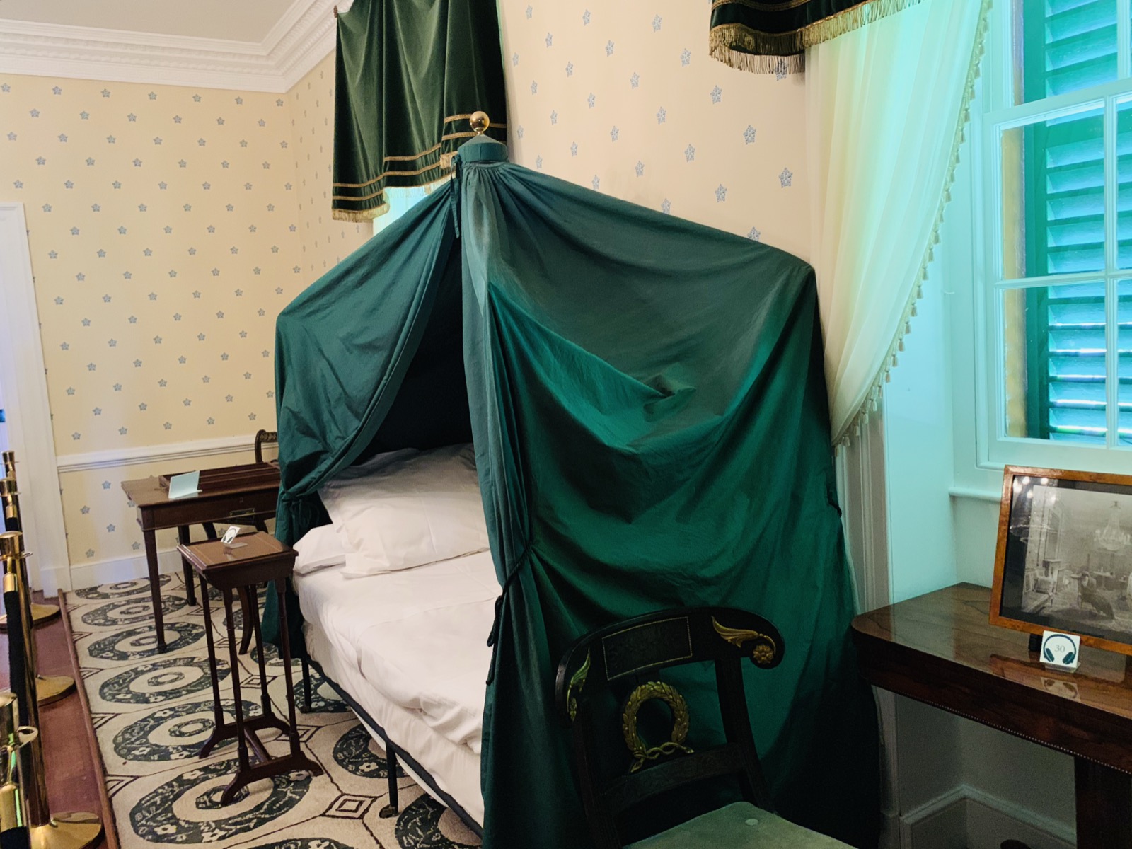 Napoleon's bedroom at Longwood House — the green canopy bed where he slept during his years of exile