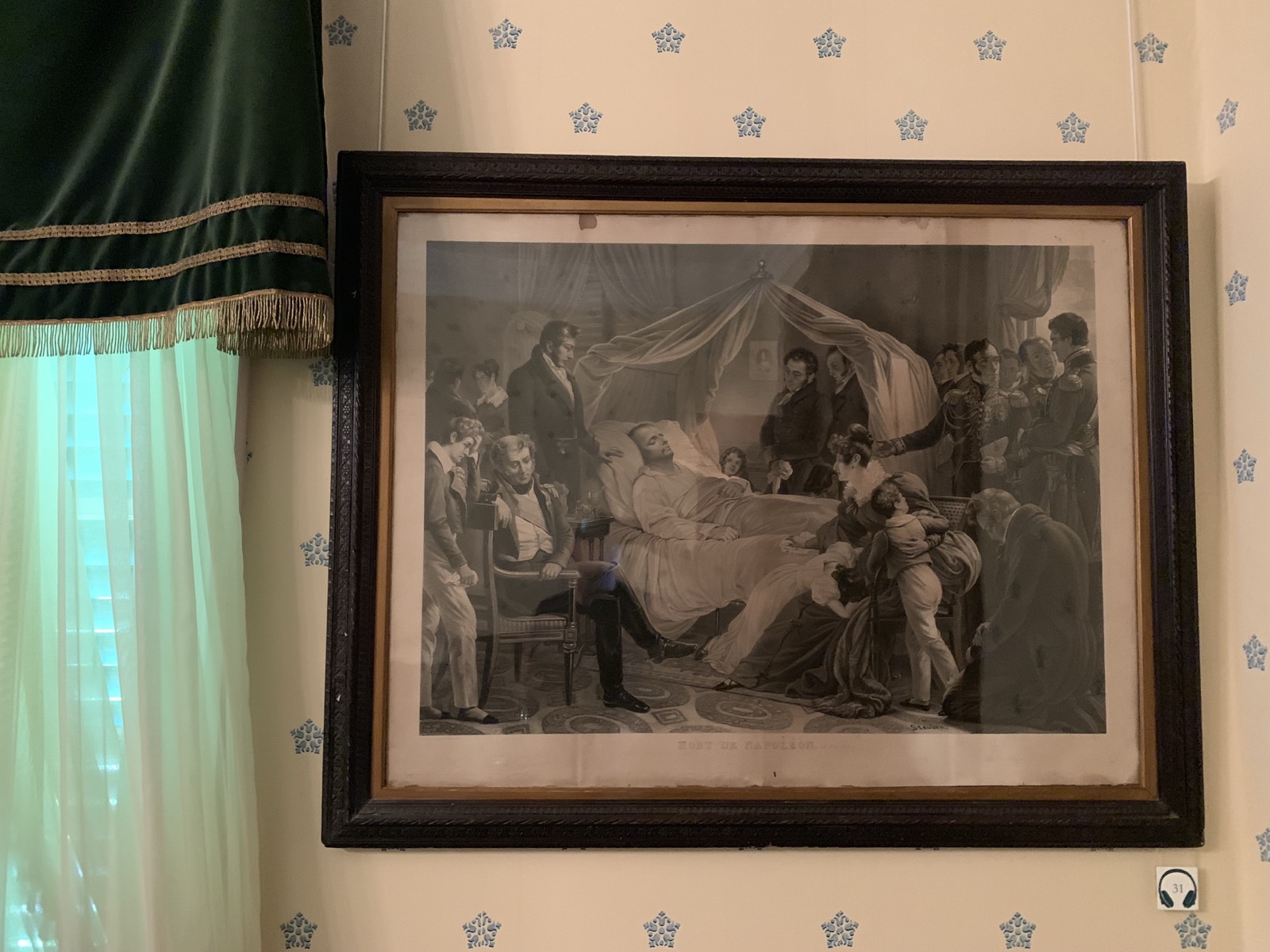 A large painting hanging in Longwood House depicting Napoleon on his deathbed, surrounded by his entourage