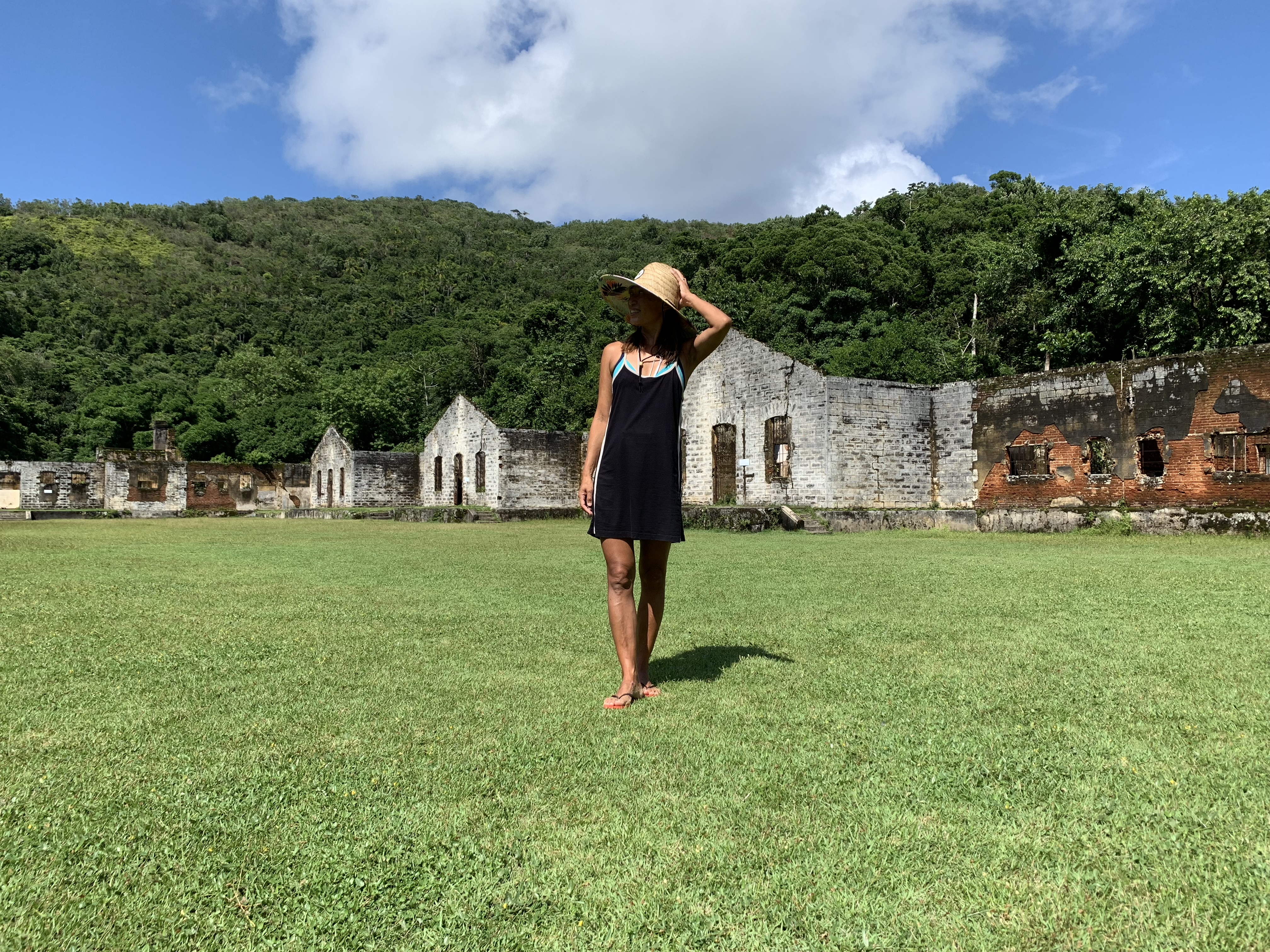 Yuka walking through the prison ruins at Ilha Anchieta