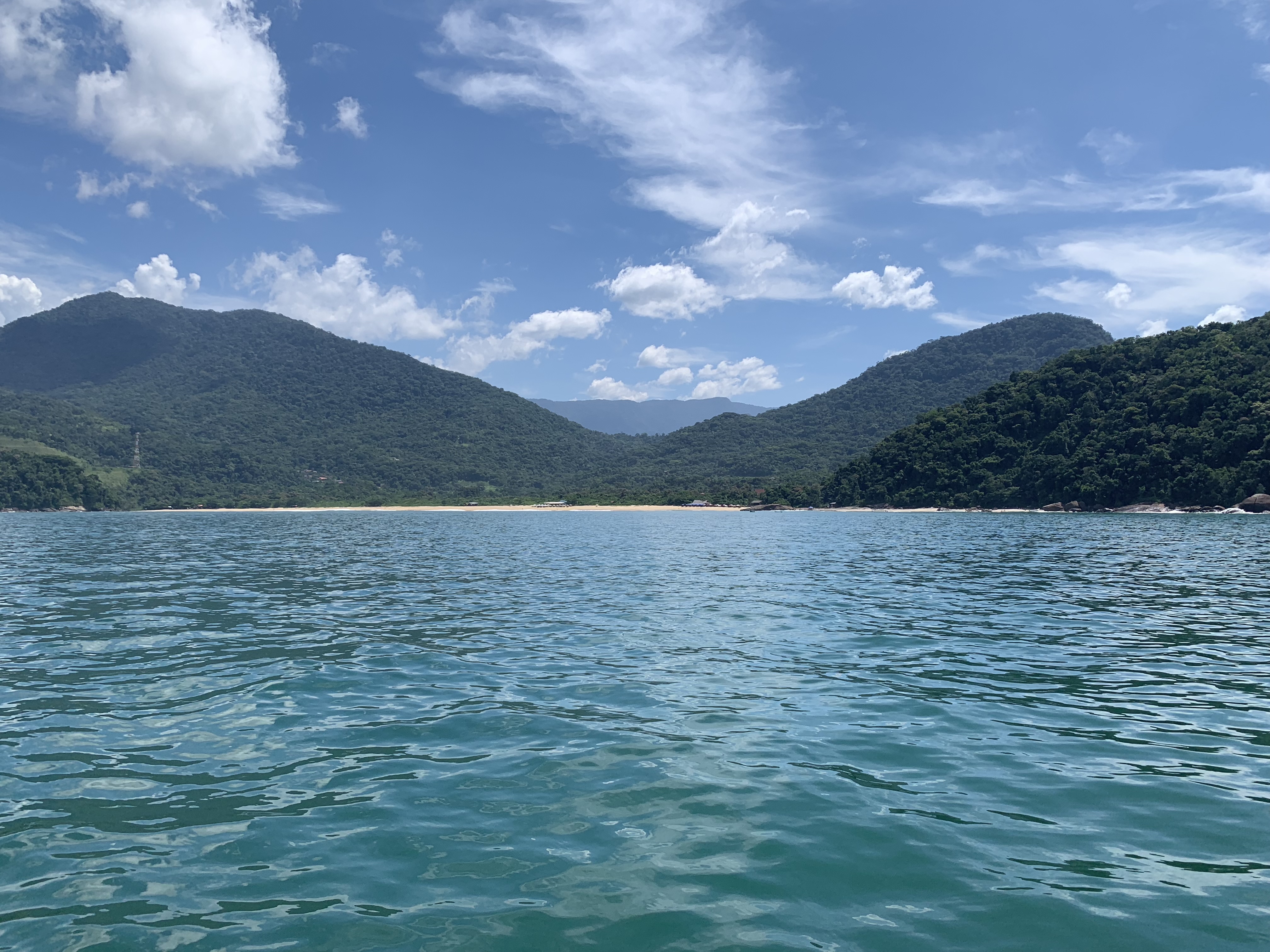 The Ilha Anchieta anchorage between green hills